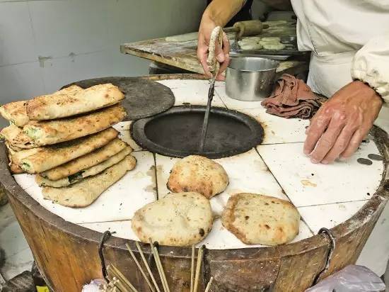 靠卖烧饼攒7套房